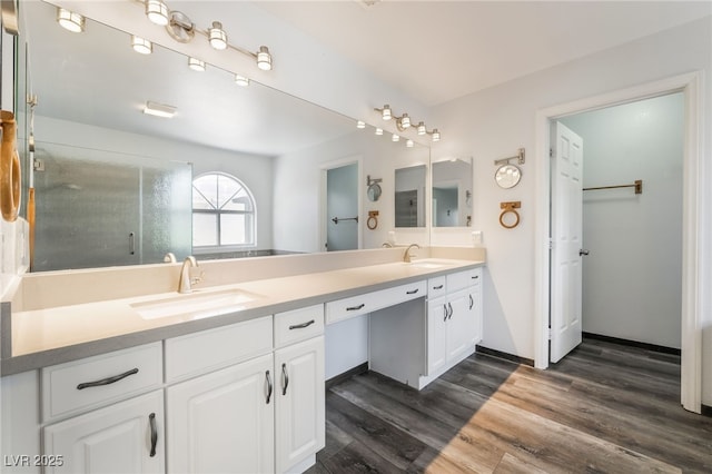 5217 Cold River Ave, Las Vegas, NV 89130 - full bath featuring double vanity, wood finished floors, and an enclosed shower