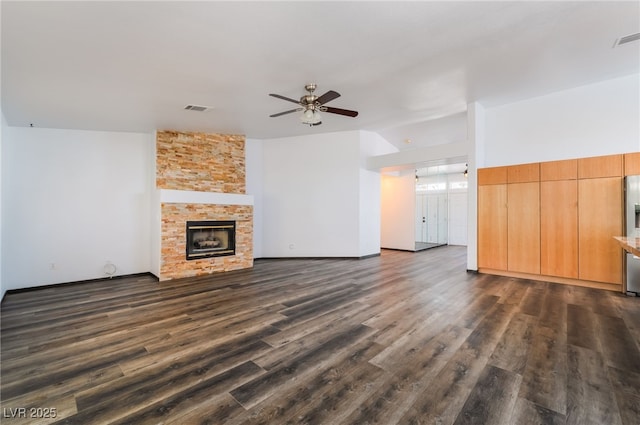 5217 Cold River Ave, Las Vegas, NV 89130 - unfurnished living room featuring a ceiling fan, dark wood finished floors, and a fireplace