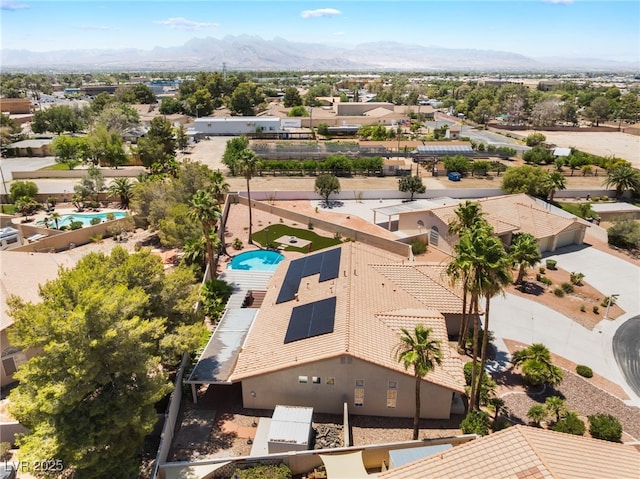 5217 Cold River Ave, Las Vegas, NV 89130 - aerial perspective of suburban area featuring a pool and mountains