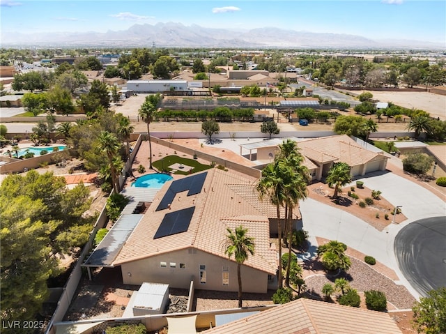 5217 Cold River Ave, Las Vegas, NV 89130 - aerial perspective of suburban area with a pool area and mountains