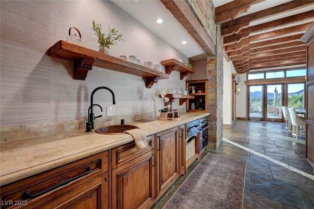 15 Rue Du Rivoli Pl, Henderson, NV 89011 - indoor wet bar featuring stone tile flooring, beam ceiling, a towering ceiling, recessed lighting, and oven