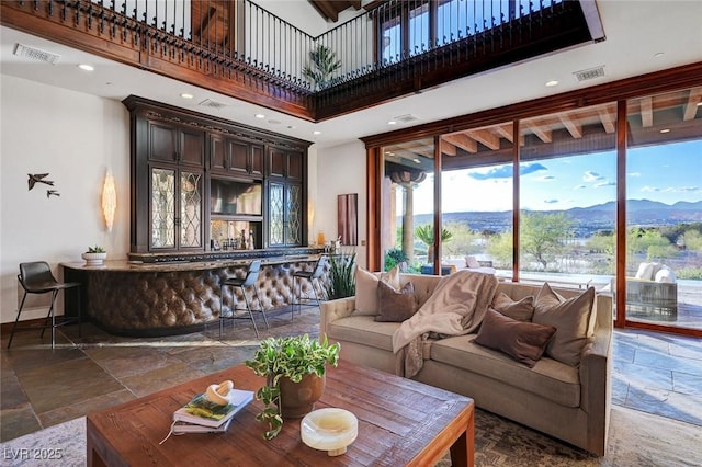 15 Rue Du Rivoli Pl, Henderson, NV 89011 - living area with stone tile flooring, a towering ceiling, and recessed lighting