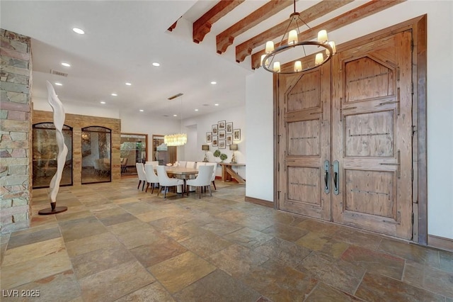 15 Rue Du Rivoli Pl, Henderson, NV 89011 - entrance foyer with a chandelier, stone tile flooring, recessed lighting, and beam ceiling