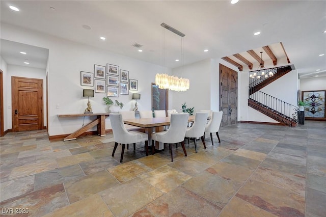 15 Rue Du Rivoli Pl, Henderson, NV 89011 - dining room with stone tile flooring, stairs, a chandelier, and recessed lighting