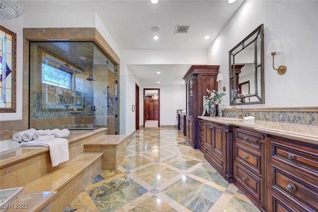 15 Rue Du Rivoli Pl, Henderson, NV 89011 - bathroom with marble tiled flooring, inlaid floor details, a tile shower, recessed lighting, and vanity