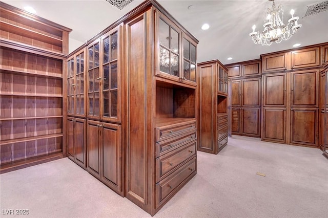 15 Rue Du Rivoli Pl, Henderson, NV 89011 - walk in closet with light colored carpet and a chandelier