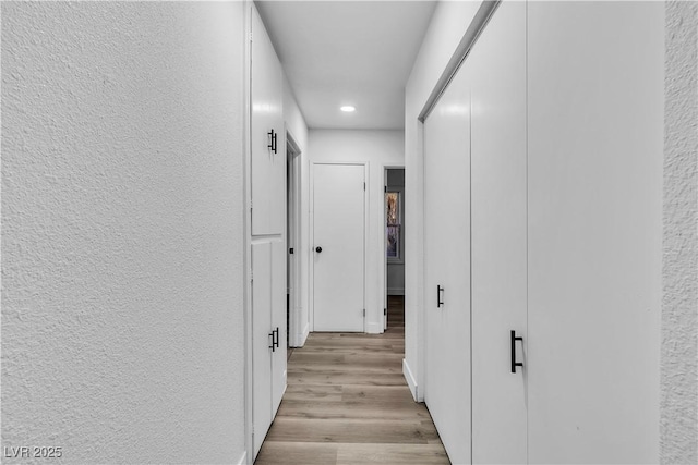 2204 Monterey Ave, Las Vegas, NV 89104 - corridor featuring recessed lighting, light wood-style floors, and a textured wall
