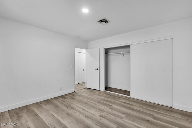 2204 Monterey Ave, Las Vegas, NV 89104 - unfurnished bedroom featuring baseboards, wood finished floors, and a closet