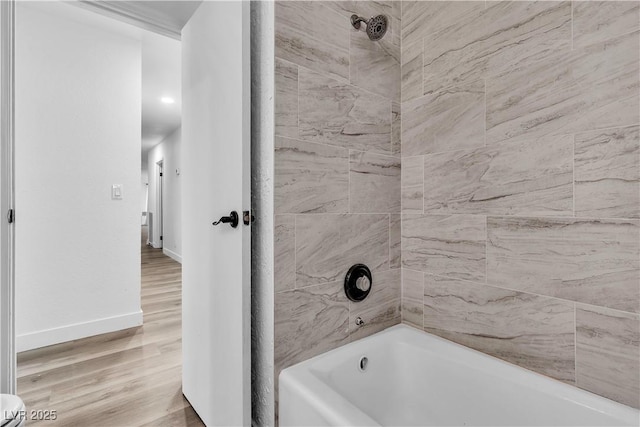 2204 Monterey Ave, Las Vegas, NV 89104 - full bath featuring shower / bathtub combination, wood finished floors, and baseboards