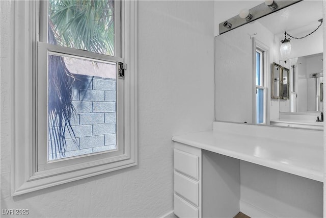 2204 Monterey Ave, Las Vegas, NV 89104 - bathroom featuring healthy amount of natural light and a textured wall