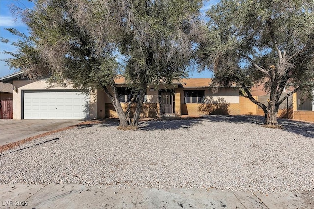 2204 Monterey Ave, Las Vegas, NV 89104 - ranch-style home featuring concrete driveway, an attached garage, fence, and brick siding