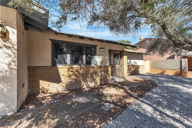 2204 Monterey Ave, Las Vegas, NV 89104 - view of front of house with stucco siding, fence, and brick siding