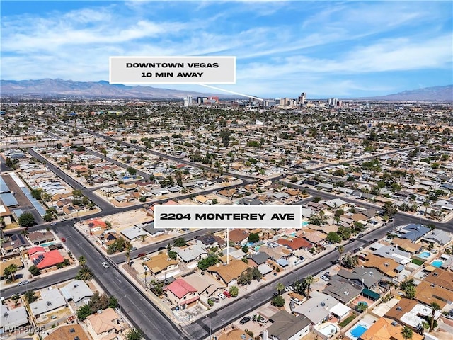 2204 Monterey Ave, Las Vegas, NV 89104 - aerial overview of property's location with mountains and nearby suburban area