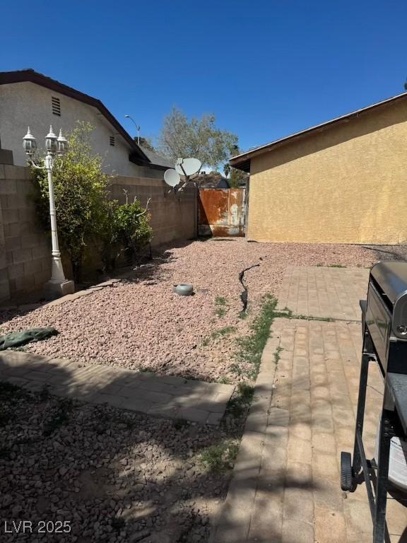 6801 Atwood Ave, Las Vegas, NV 89108 - view of yard featuring a patio and fence