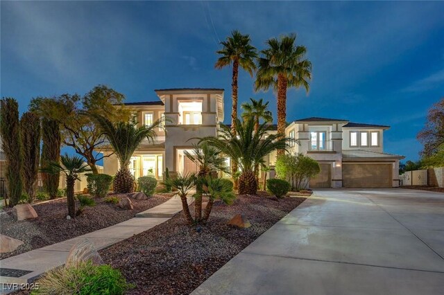 10550 Patrington Ct, Las Vegas, NV 89183 - mediterranean / spanish-style house featuring a garage, driveway, and stucco siding