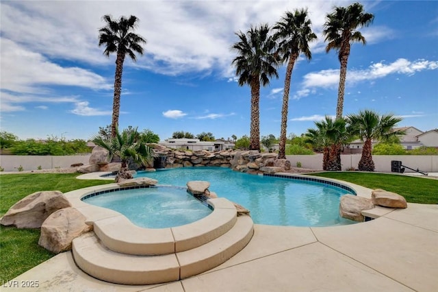 10550 Patrington Ct, Las Vegas, NV 89183 - view of swimming pool with fence, a yard, a pool with connected hot tub, and a patio