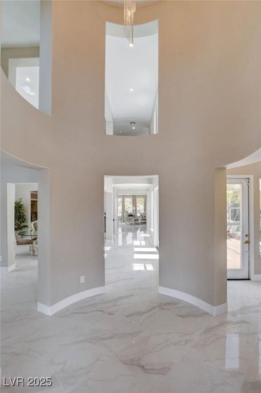 10550 Patrington Ct, Las Vegas, NV 89183 - interior space with a high ceiling, marble finish floor, and baseboards