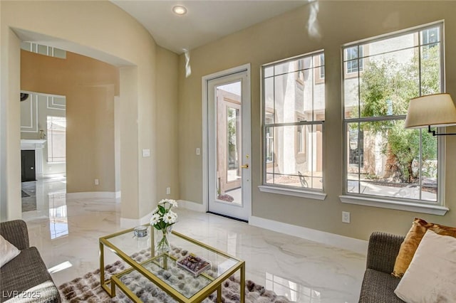 10550 Patrington Ct, Las Vegas, NV 89183 - living room featuring arched walkways, visible vents, baseboards, recessed lighting, and marble finish floor
