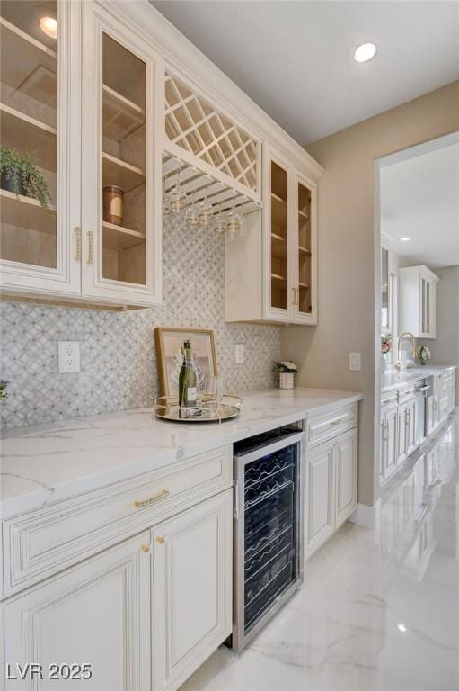 10550 Patrington Ct, Las Vegas, NV 89183 - bar featuring recessed lighting, beverage cooler, marble finish floor, a dry bar, and tasteful backsplash