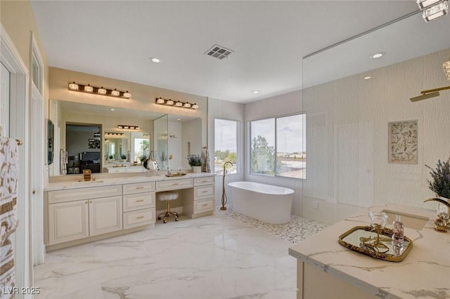10550 Patrington Ct, Las Vegas, NV 89183 - full bath featuring recessed lighting, marble finish floor, a freestanding bath, visible vents, and vanity