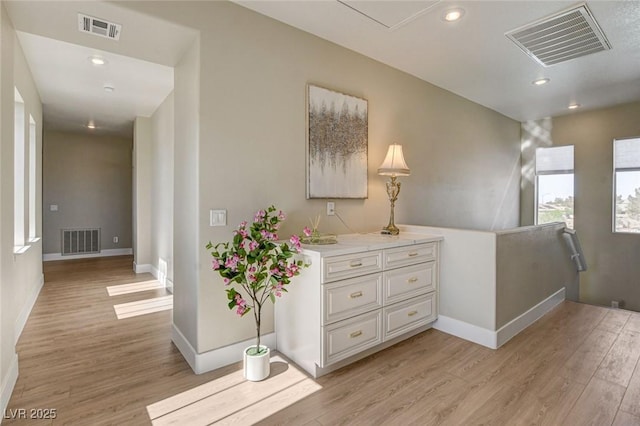 10550 Patrington Ct, Las Vegas, NV 89183 - corridor featuring baseboards, light wood-style flooring, and visible vents
