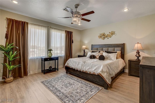 10550 Patrington Ct, Las Vegas, NV 89183 - bedroom with recessed lighting, visible vents, light wood finished floors, and baseboards