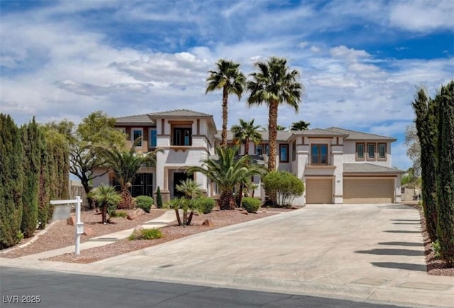10550 Patrington Ct, Las Vegas, NV 89183 - view of front of home with stucco siding, driveway, and a garage
