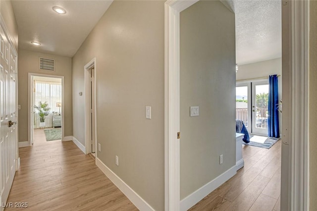 10550 Patrington Ct, Las Vegas, NV 89183 - hall with recessed lighting, light wood-style flooring, visible vents, and baseboards