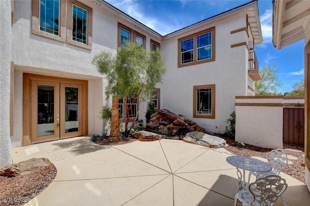 10550 Patrington Ct, Las Vegas, NV 89183 - back of house featuring stucco siding, a patio area, and french doors