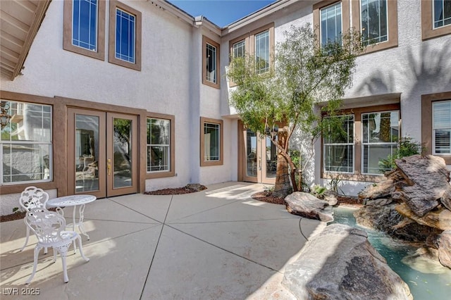 10550 Patrington Ct, Las Vegas, NV 89183 - rear view of property featuring a patio area, french doors, and stucco siding