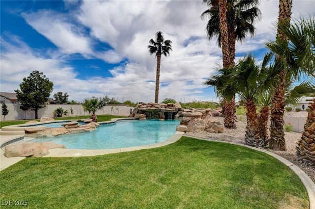 10550 Patrington Ct, Las Vegas, NV 89183 - view of pool with a pool with connected hot tub, a lawn, and fence