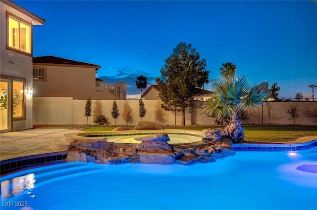 10550 Patrington Ct, Las Vegas, NV 89183 - view of swimming pool featuring a fenced in pool, a fenced backyard, and an in ground hot tub