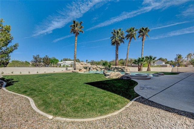 10550 Patrington Ct, Las Vegas, NV 89183 - view of yard featuring fence private yard, a patio, and an in ground hot tub
