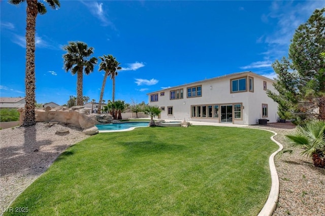 10550 Patrington Ct, Las Vegas, NV 89183 - back of house featuring a lawn, a fenced in pool, central air condition unit, and stucco siding