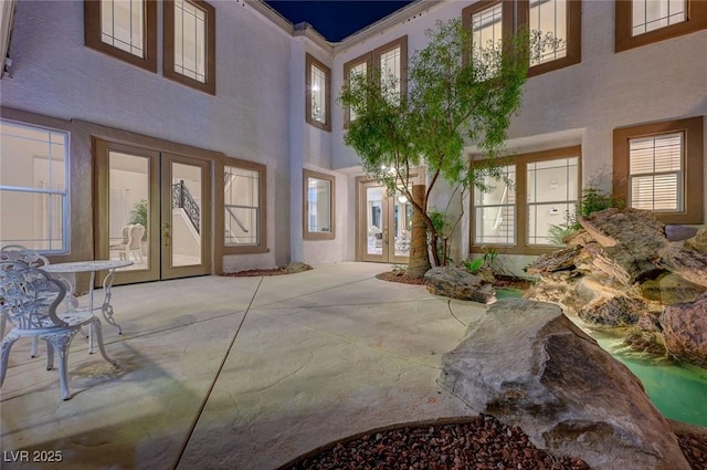 10550 Patrington Ct, Las Vegas, NV 89183 - exterior space with french doors, a patio area, and stucco siding