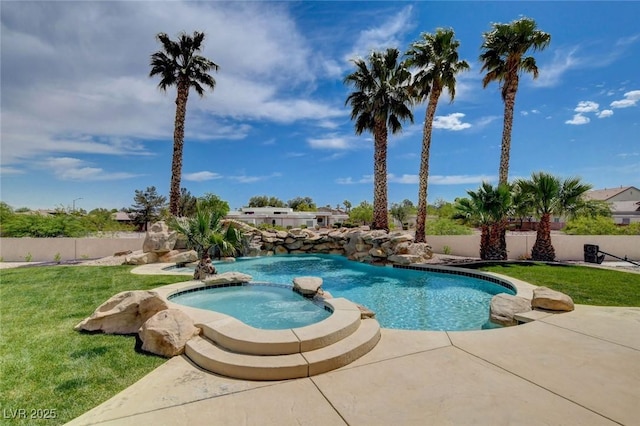 10550 Patrington Ct, Las Vegas, NV 89183 - view of pool with fence, a lawn, a pool with connected hot tub, and a patio