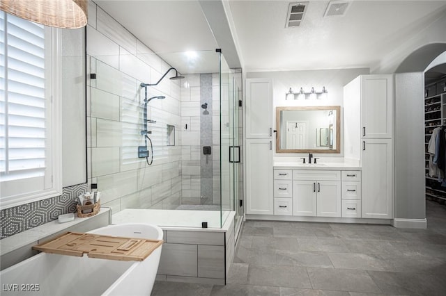 5815 Pristine Falls Ave, Las Vegas, NV 89131 - full bath with a shower stall, vanity, a freestanding bath, and tasteful backsplash