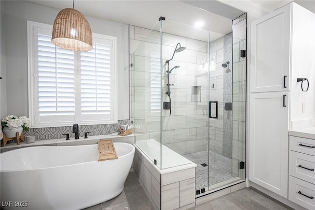 5815 Pristine Falls Ave, Las Vegas, NV 89131 - bathroom featuring a soaking tub and a shower stall