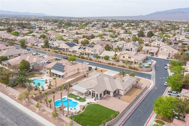 5815 Pristine Falls Ave, Las Vegas, NV 89131 - aerial perspective of suburban area with a pool and a mountainous background