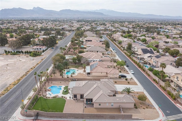 5815 Pristine Falls Ave, Las Vegas, NV 89131 - aerial view of residential area with a pool area and a mountainous background