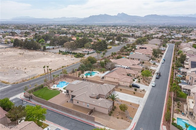 5815 Pristine Falls Ave, Las Vegas, NV 89131 - aerial view of residential area with a pool area and a mountainous background