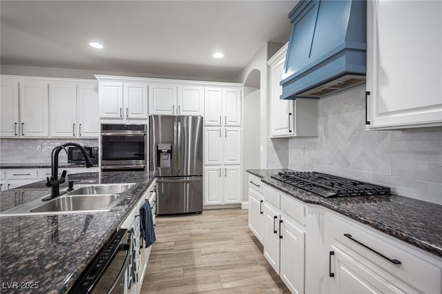 5815 Pristine Falls Ave, Las Vegas, NV 89131 - kitchen with appliances with stainless steel finishes, custom range hood, a sink, white cabinetry, and recessed lighting