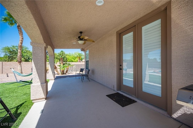 5815 Pristine Falls Ave, Las Vegas, NV 89131 - fenced backyard with ceiling fan and a patio