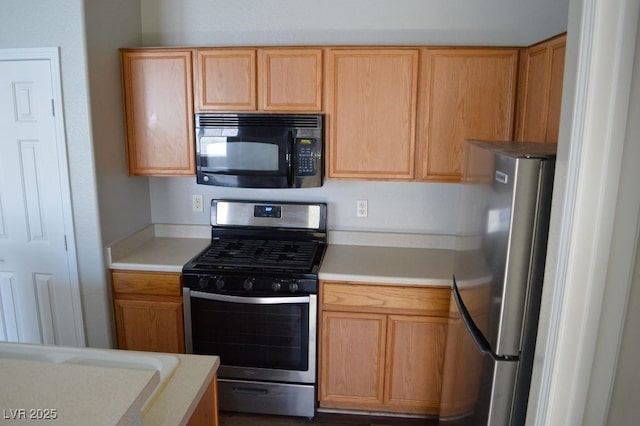 9303 Gilcrease Ave Unit 1097, Las Vegas, NV 89149 - kitchen with light countertops and appliances with stainless steel finishes