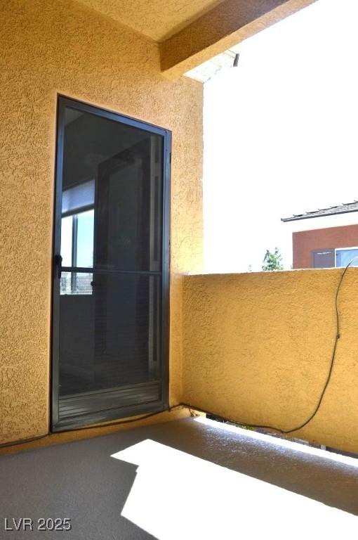 9303 Gilcrease Ave Unit 1097, Las Vegas, NV 89149 - entrance to property featuring a balcony and stucco siding