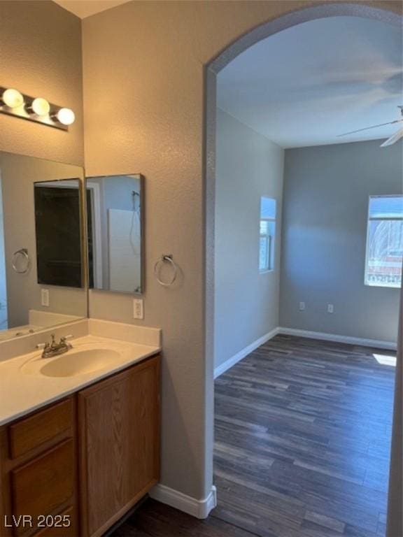 9303 Gilcrease Ave Unit 1097, Las Vegas, NV 89149 - bathroom with baseboards, wood finished floors, vanity, and plenty of natural light