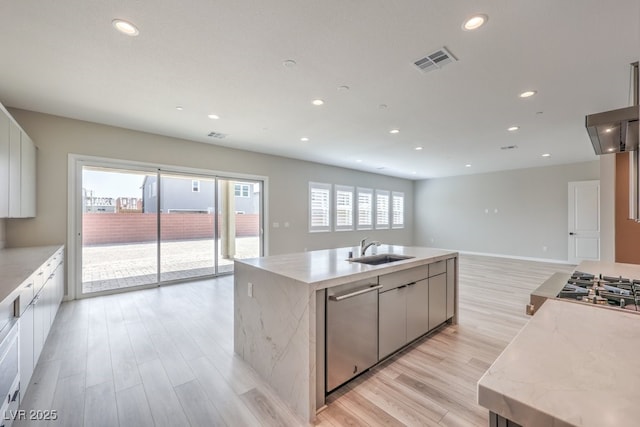 kitchen featuring a sink, light wood-type flooring, visible vents, recessed lighting, and appliances with stainless steel finishes