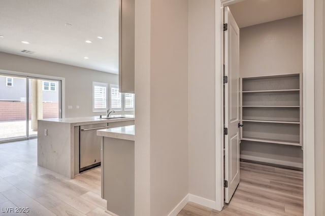 interior space with a sink and visible vents