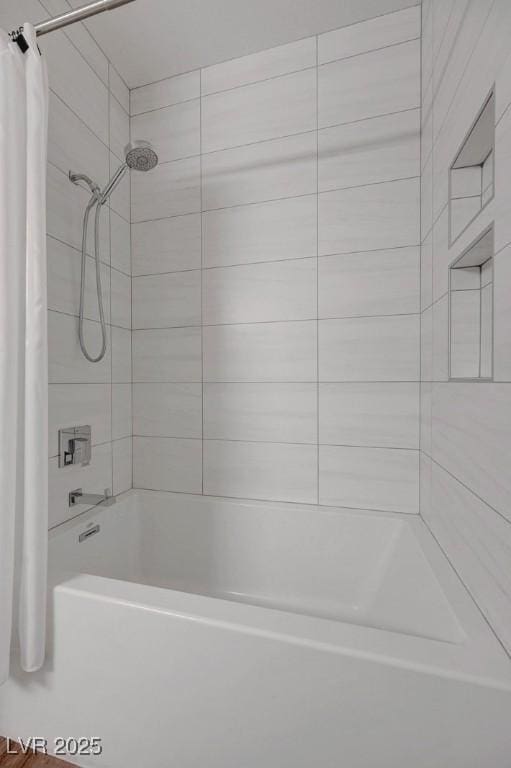 bathroom with shower / bathtub combination with curtain