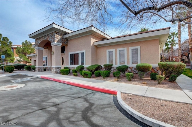 view of property with uncovered parking